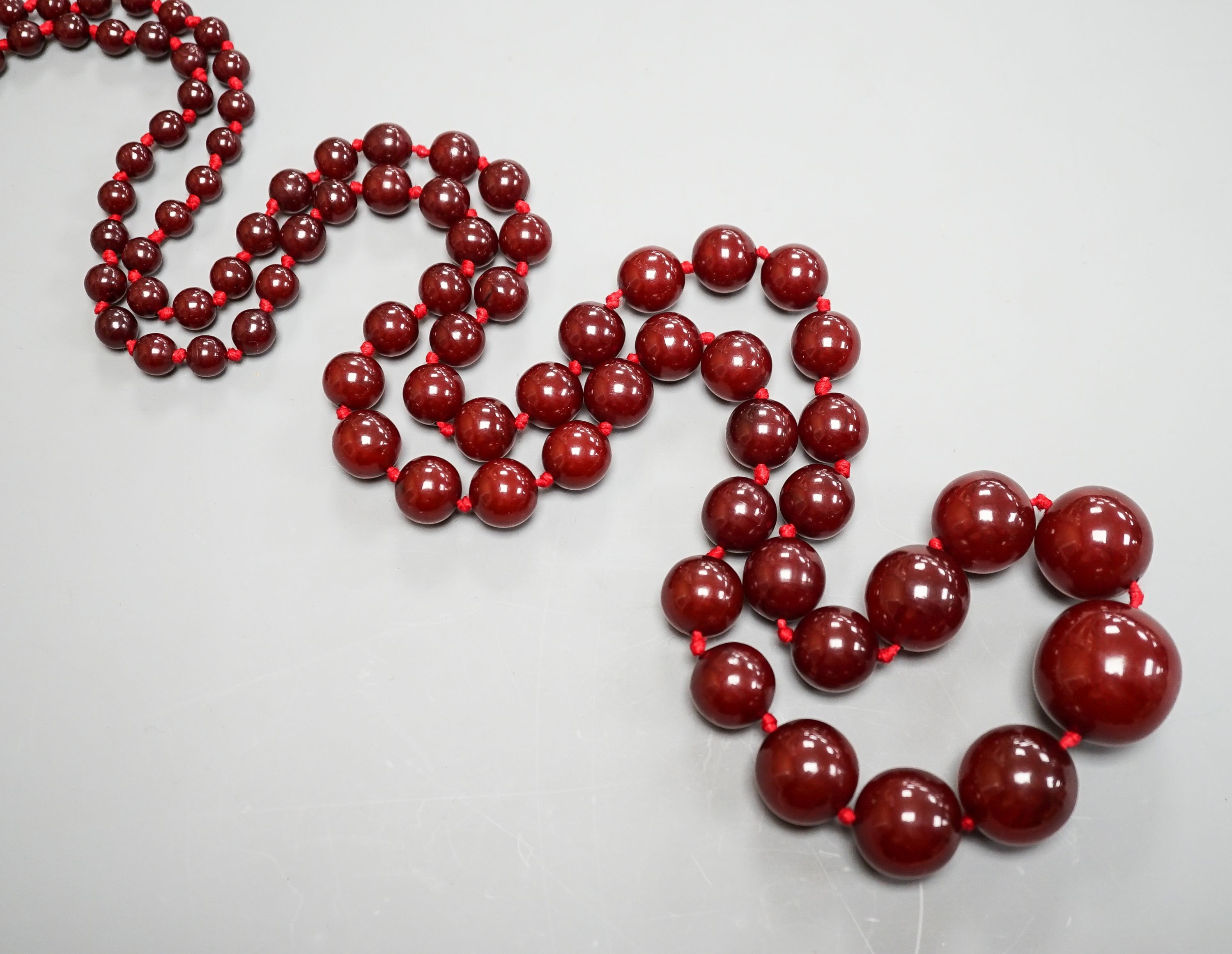 A graduated cherry amber bead necklace, 110cm, gross weight 94 grams.